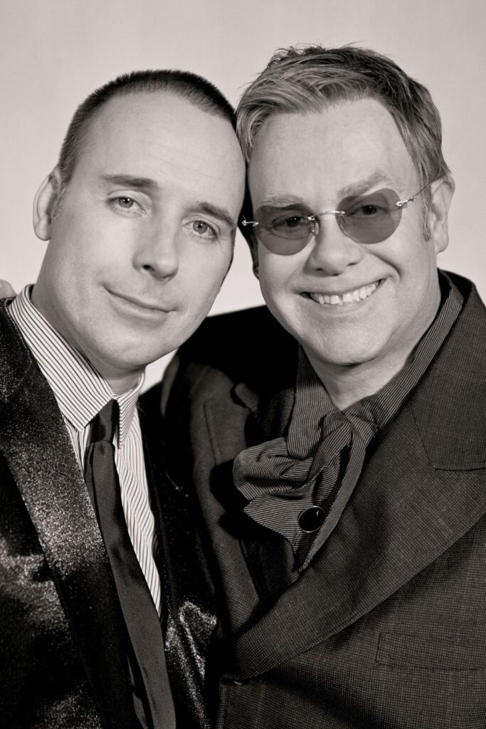 black and white portrait of elton john and david furnish when they were young